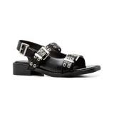 Sandalias bajas negras de cuero sintético, con hebillas plateadas y suela track.