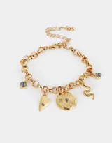 Pulsera dorada flexible con dijes místicos y strass. Incluye dijes de corazón, serpiente, moneda y cristales grises. Cierre de mosquetón con cadena de alargue.