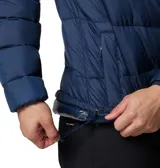 Campera acolchada para hombre, color azul marino, con capucha y cierre frontal. Presenta tecnología Omni-HEAT™ reflectiva y aislamiento Thermarator™.