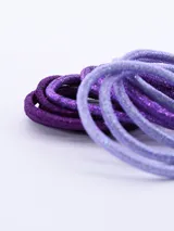 Pack de 12 coleros para el pelo, en tonos de violeta y lila con glitter.