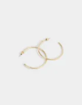 Aros argollas dorados de metal, de 40mm de diámetro y cierre a presión.