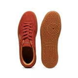 Championes Puma Palermo negros con detalles en blanco y suela color caramelo.