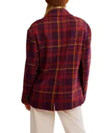 Blazer cruzado de corte oversize, con solapas amplias y hombros estructurados. Presenta un estampado tartán en tonos burdeos, morado y amarillo.