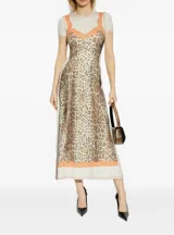 Vestido midi ajustado de jersey elástico con estampado animal print y detalles de encaje color durazno en escote y ruedo.