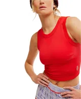 Musculosa blanca de punto acanalado con corte crop, escote redondo y sisas anchas.