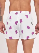 Bóxer de algodón con estampado floral en tonos azul y blanco, con cintura elástica y logo de la marca en el centro.