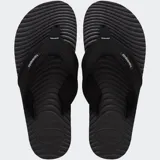 Ojotas Havaianas Surfer Coast de goma color negro, con plantilla texturizada y tira ancha de tela con logo de la marca.