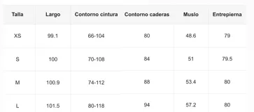 Pantalón acampanado negro con cintura alta drapeada y paneles de encaje floral en los laterales.