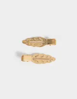 Set de dos hebillas doradas para el pelo con forma de hoja calada.