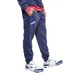 Pantalón de jogging azul con puños ajustados, escudo del Club Nacional de Football y logo de Umbro.