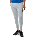 Pantalón deportivo color beige de hombre, ajustado y con detalles gráficos en los laterales.