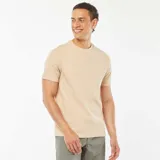 Camiseta color beige claro de punto jacquard con cuello redondo y mangas cortas.