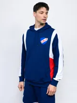 Buzo canguro azul con capucha, recortes blancos y rojos, y escudo del Club Nacional de Football estampado en el pecho.