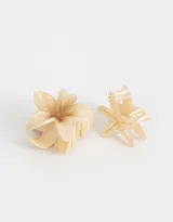 Set de dos broches para el pelo con forma de flor hawaiana y estrella de mar, color beige.