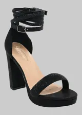 Sandalias negras de tacón alto con plataforma, pulsera al tobillo con hebilla y detalle de strass.