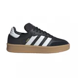 Zapatillas deportivas de cuero negro con detalles en blanco y suela de goma, diseño clásico y atemporal.