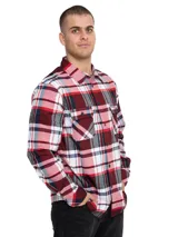 Camisa de manga larga con estampado a cuadros en tonos rojo, blanco, azul y gris. Tiene dos bolsillos en el pecho con cierre de botón, puños ajustables con botón y un paño de microfibra oculto en el dobladillo delantero.