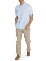 Pantalón de lino color beige, con pretina de jersey ajustable, calce regular, bolsillos en el frente y trasero.