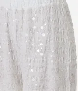 Pantalón wide leg de lentejuelas color blanco, con cintura alta y elástica.