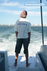 Camiseta celeste con estampado frontal y trasero con el texto "Ittai Stars" en color rojo y azul.