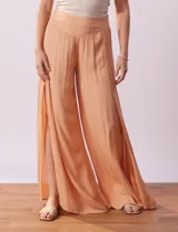 Pantalón Sound Style color naranja de gasa bambula con pretina ancha elastizada en la espalda y tajos en el frente.