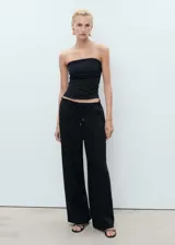 Pantalón palazzo negro de lino y viscosa, con cintura elástica ajustable con cordón.