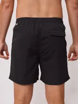 Short de baño color lila con cordón ajustable en la cintura y parche con logo de la marca en la pierna.