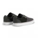 Championes Etnies Blitz de lona azul marino con logo de la marca en el lateral y suela de goma color caramelo.
