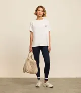 Calza deportiva larga de microfibra color azul marino, con cintura alta y recortes en blanco en la parte inferior de las piernas.