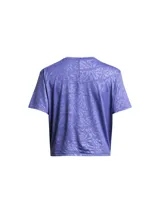 Remera deportiva Under Armour color fucsia con estampado floral en relieve y logo en el pecho.