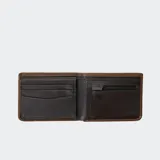 Billetera negra de cuero con costuras marrones, ventana de identificación, protección RFID, múltiples ranuras para tarjetas, monedero con cremallera, compartimento para billetes y cierre de clip.