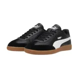 Championes Puma 9T blancos con detalles en verde y beige, suela color caramelo.