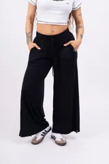 Pantalón palazzo negro de morley con lycra, corte amplio y cintura elastizada con cordón ajustable.