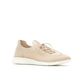 Zapatillas deportivas de punto color beige, con cordones y suela blanca.