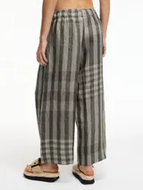 Pantalón a cuadros verde y gris, de lino, con pretina elástica, tiro medio-bajo y bolsillos laterales.