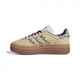 Zapatillas Adidas Gazelle Bold para mujer. Capellada de gamuza color beige con estampado animal print en las tres tiras laterales y en el talón. Plataforma de goma color caramelo.