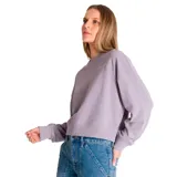 Buzo color crema de corte holgado, con cuello redondo y logo de la marca bordado en el pecho.