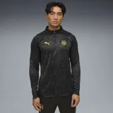 Buzo deportivo negro con cierre 1/4, logo de Puma amarillo en el pecho y escudo del Club Atlético Peñarol.
