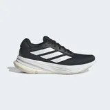 Championes de running Adidas modelo Supernova Ease, color negro con las tres tiras características en blanco. Cuentan con un exterior de malla transpirable, mediasuela Dreamstrike para amortiguación y suela de goma blanca.