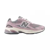 Championes New Balance U2010 de gamuza y malla color lila con detalles en gris y blanco.