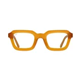 Lentes de receta Indie, modelo Tune, con montura cuadrada color miel y patillas finas.