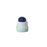 Championes Lacoste Gripshot de lona blanca con detalles en azul marino en el talón y verde agua en los cordones y la suela.