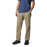Pantalón largo convertible en short, color caqui, de corte recto y tiro medio. Cuenta con bolsillos laterales con cierre, bolsillos cargo con velcro y cintura parcialmente elástica con cinturón removible.