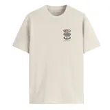 Remera color crema de manga corta con cuello redondo y estampado en el pecho con el logo de Quiksilver y un símbolo de la paz.