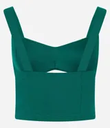 Top cropped de color verde esmeralda, confeccionado en bengalina de viscosa certificada. Presenta escote corazón con un detalle de abertura en el busto y breteles anchos.