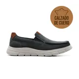 Zapato casual Hi-Tec Lier de cuero color gris con detalles en marrón. Diseño slip-on con elásticos laterales y suela blanca de goma.