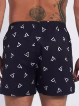 Bóxer de algodón blanco con estampado de flores pequeñas color celeste, con cintura elástica y logo de la marca en el centro.