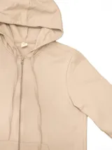 Campera deportiva unisex color verde esmeralda, confeccionada en algodón con felpa, con capucha, cierre frontal y bolsillos tipo canguro.