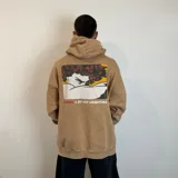 Canguro negro con efecto gastado, corte oversize, capucha con cordones ajustables y bolsillo tipo canguro. Estampa en el pecho con un personaje de caricatura y texto.