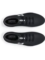 Championes de running Under Armour Charged Surge 4, color negro con logo blanco y suela blanca.